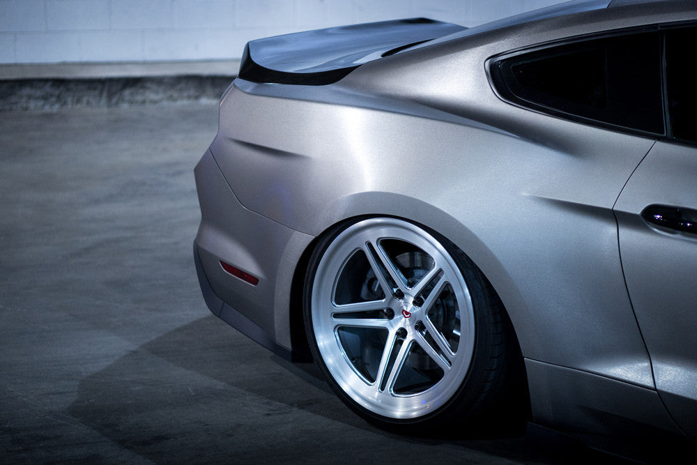 Wide rear view of the installed Anderson Composites Type-ST Carbon Fiber Decklid on a Ford Mustang, highlighting perfect OEM alignment and fit.