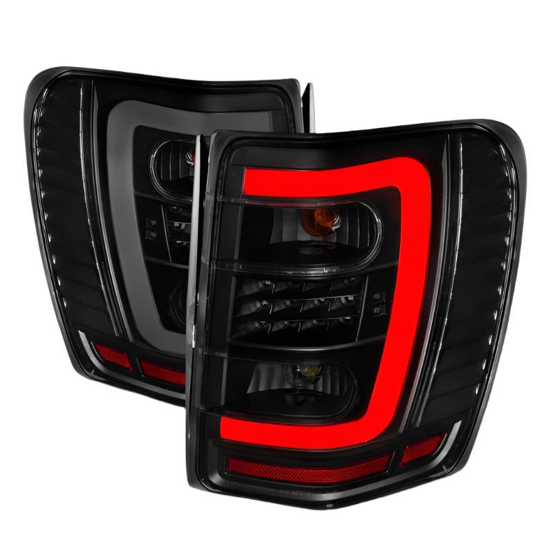 ANZO 1999-2004 Jeep Grand Cherokee LED Tail Lights w/ Light Bar Black Housing Smoke Lens - Black Ops Auto Works