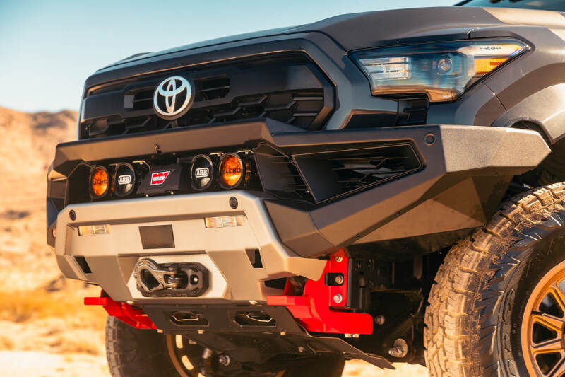 Close-up of the ARB Zenith bumper grille and integrated auxiliary lights on a Tacoma