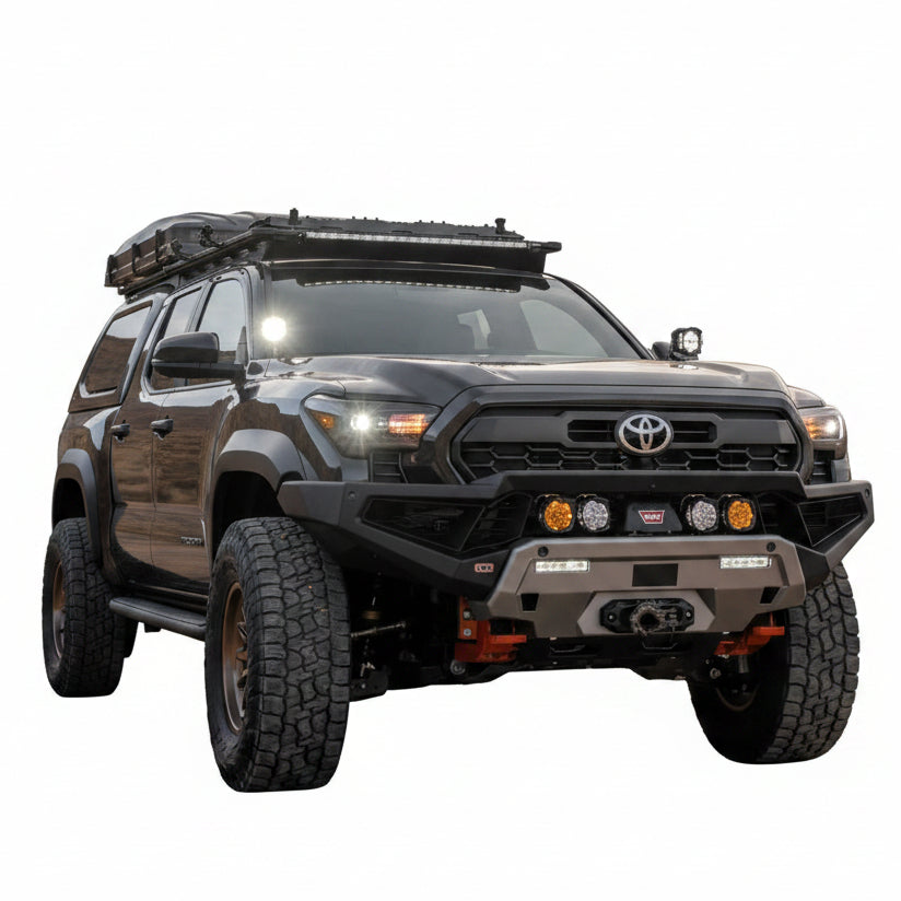 ARB Zenith winch bumper installed on a lifted Toyota Tacoma front three-quarter view