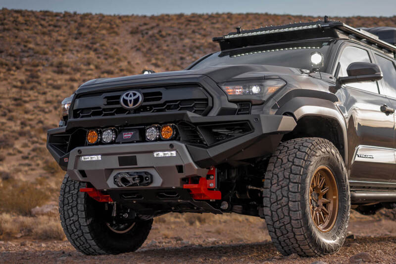 ARB Zenith winch bumper on a Toyota Tacoma parked on desert terrain