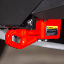 Load image into Gallery viewer, Representative installed close up of a red ARB forged recovery point showing the ARB warning label with the 8000 kg maximum snatch strap and 4.75 tonne shackle ratings, pictured with under vehicle protection that is not included