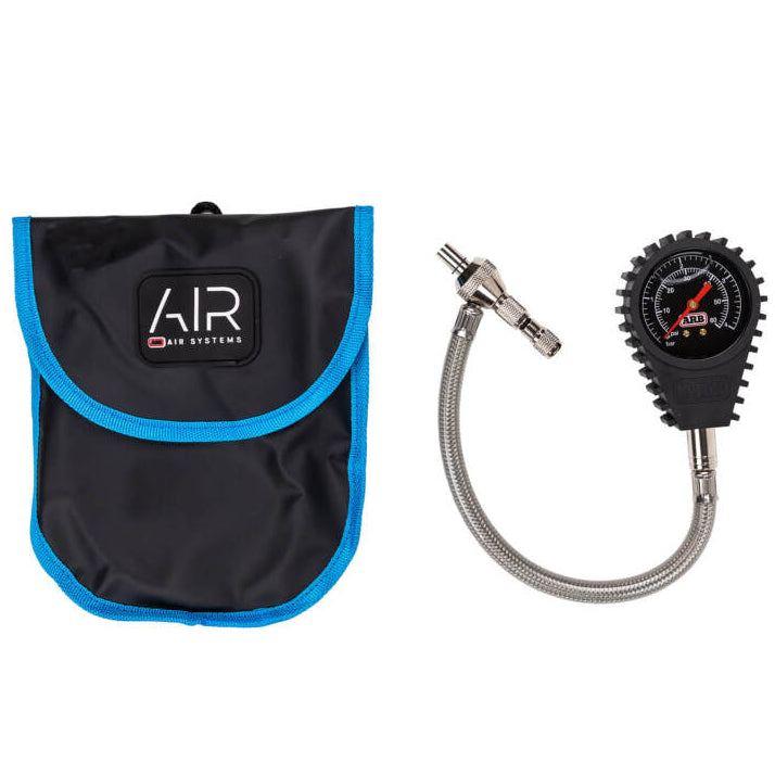 Close up of ARB600A analog tire deflator gauge with valve core removal tool