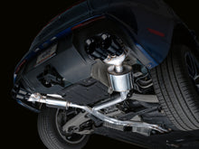 Load image into Gallery viewer, Front underside view of Porsche Macan 2.9TT showing installed AWE Tuning Touring Edition Catback Exhaust piping and components