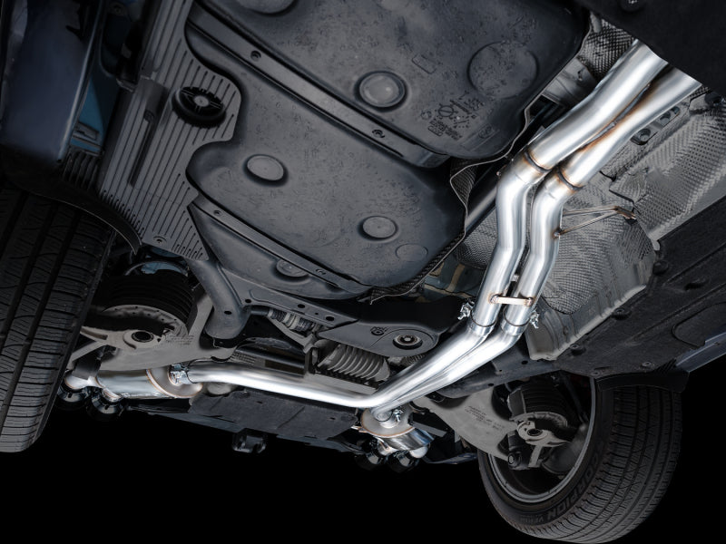 Rear three-quarter view of blue Porsche Macan 2.9TT showing AWE Tuning Touring Edition Catback Exhaust with diamond black quad tips installed