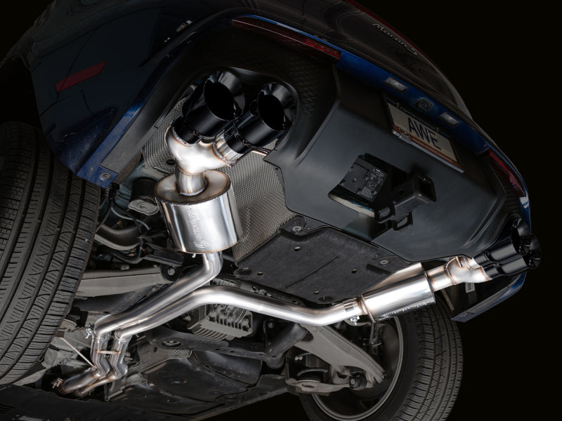 Full underside view of Porsche Macan 2.9TT showing installed AWE Tuning Touring Edition Catback Exhaust system piping
