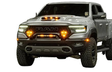 Load image into Gallery viewer, Baja Designs LP9 Pro LED lights installed in the front bumper of a 2021+ RAM 1500 TRX, delivering high-output forward lighting for off-road driving