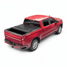 Load image into Gallery viewer, BAK BAKFlip G2 tonneau cover mounted on Chevy Silverado 1500 truck bed