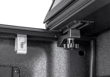 Load image into Gallery viewer, Close-up of the BAKFlip G2 corner latch and gas-strut mounting bracket