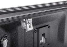 Load image into Gallery viewer, Close-up of the BAKFlip G2 bed rail clamp and mounting hardware on a Ranger