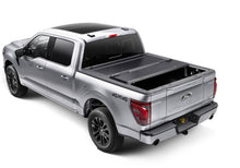Load image into Gallery viewer, White Ford Ranger with 5-foot bed and BAKFlip G2 tonneau cover closed, front three-quarter view