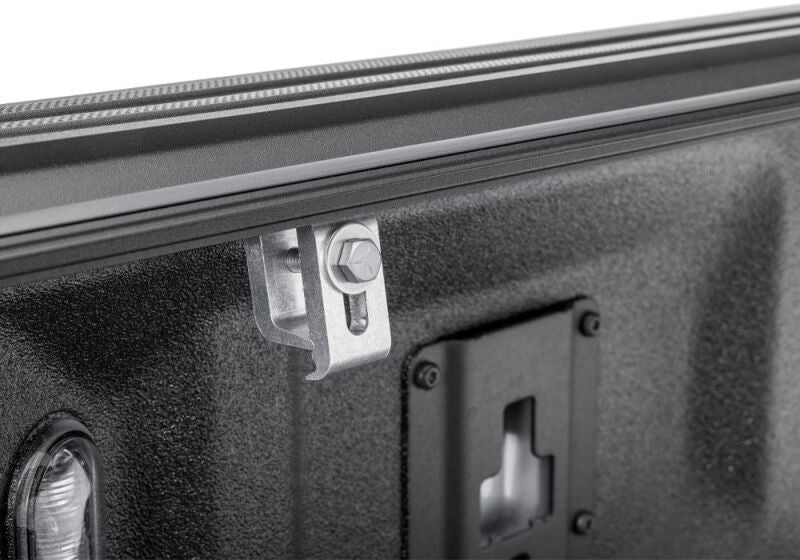 Close-up of the BAKFlip G2 bed rail clamp and mounting hardware on a Ranger 5-foot bed