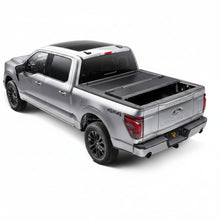 Load image into Gallery viewer, BAKFlip G2 tonneau cover closed on a silver Ford F-150, rear view showing tailgate