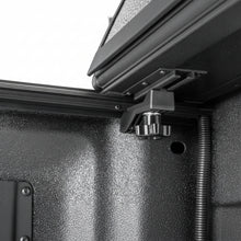 Load image into Gallery viewer, Close-up of the BAKFlip G2 corner latch and mounting bracket in the bed corner