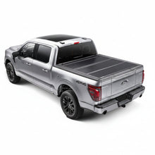 Load image into Gallery viewer, BAKFlip G2 tonneau cover closed on a silver Ford F-150 short bed, rear three-quarter view