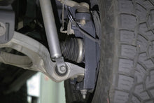 Load image into Gallery viewer, Belltech 6-8 inch lift kit installed on 2019-2025 Ram 1500 4WD showing front suspension assembly - image 10