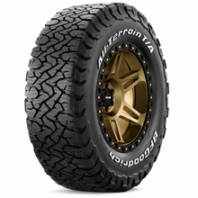 Load image into Gallery viewer, BFGoodrich 88627 All-Terrain T/A KO3 tire mounted on a bronze off-road wheel