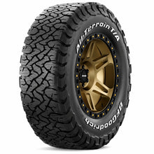 Load image into Gallery viewer, BFGoodrich 88627 All-Terrain T/A KO3 tire mounted on a bronze off-road wheel