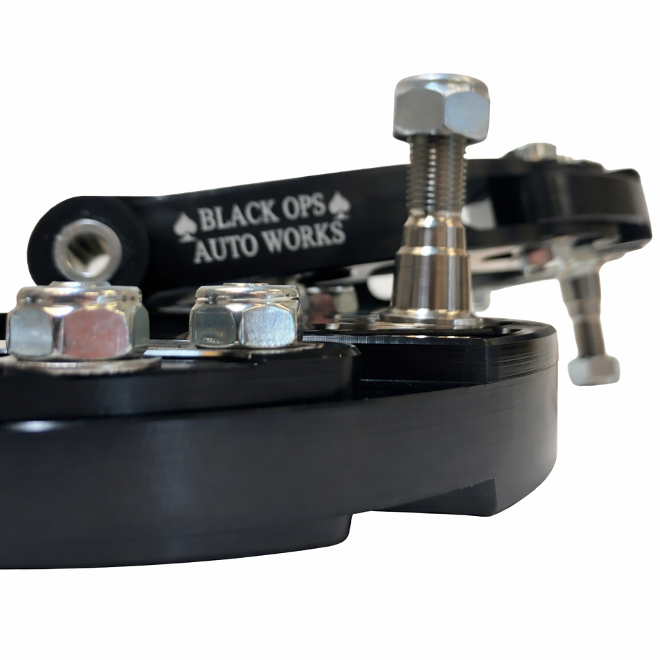 Black Ops swappable adjustment tabs for camber and caster tuning on Jeep Grand Cherokee control arms