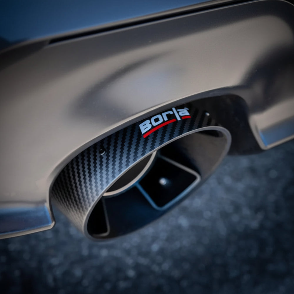Close-up of a Borla carbon-fiber exhaust tip with black anodized inner core