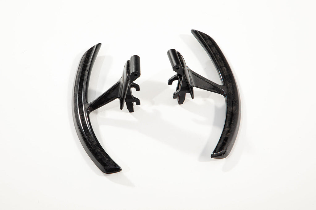 Porsche 991 carbon paddle shifter extensions stood facing inward so both paddle faces are visible