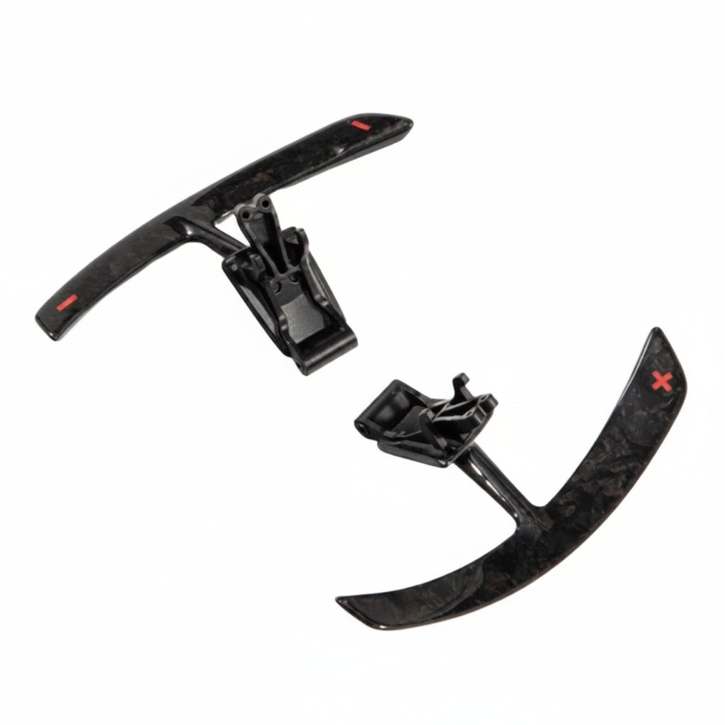 Porsche 991 carbon paddle shifter extension pair showing the small red star badge on the paddle face