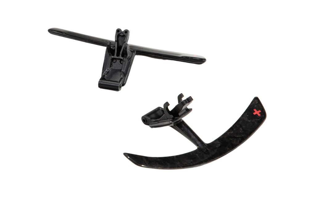 Porsche 991 carbon paddle shifter extension pair laid apart on a white background