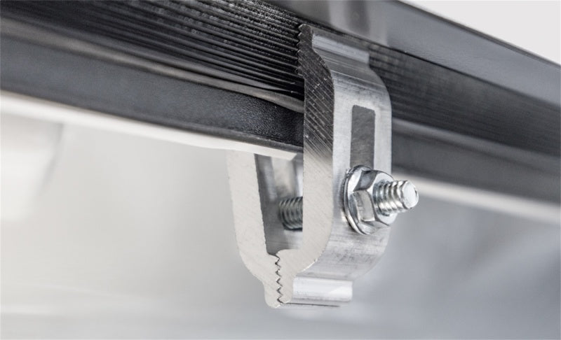 Side profile of Chevy Silverado 1500 with flush-mount LOMAX CarbonPro-compatible bed cover installed.