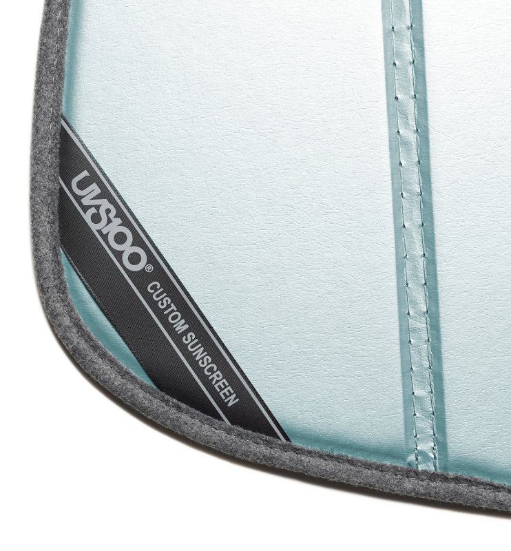 Sunscreen laid flat showing the reflective blue metallic panel surface