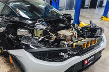 Load image into Gallery viewer, CSF high-performance intercoolers during track testing on modified McLaren 765LT