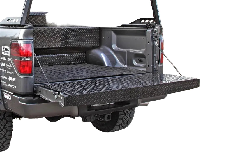 Side profile of Dee Zee black tailgate protector showing full coverage on Super Duty
