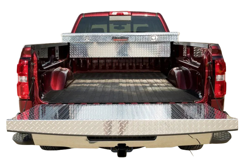 Ram truck tailgate with Dee Zee brite-tread cap during cargo loading