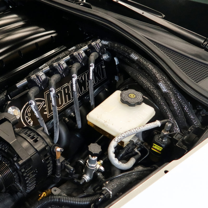 DEI Fire Sleeve installed over hoses and wiring in an engine bay