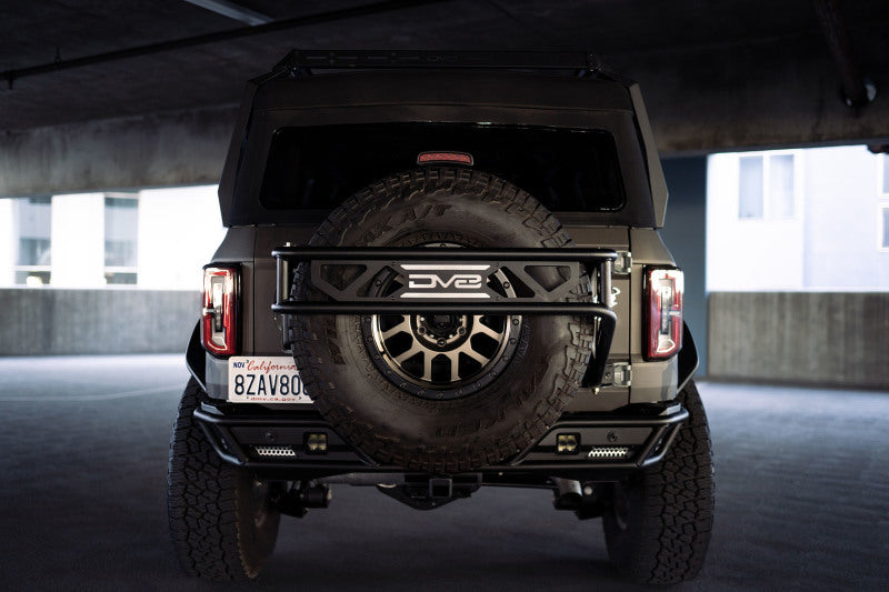 DV8 Offroad 21-23 Ford Bronco Spare Tire Guard & Accessory Mount - Black Ops Auto Works
