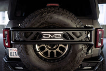 Load image into Gallery viewer, DV8 Offroad 21-23 Ford Bronco Spare Tire Guard &amp; Accessory Mount - Black Ops Auto Works