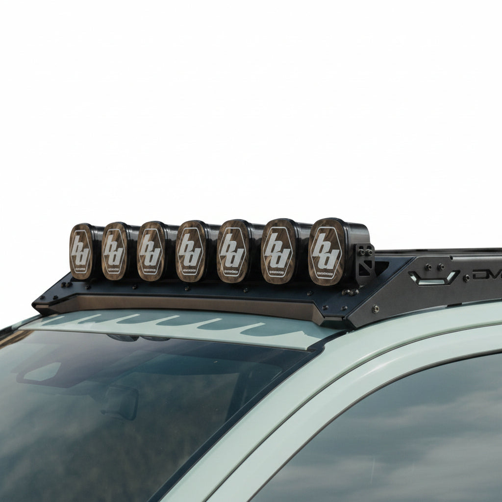 Angled shot of the mount attached to a DV8 Spec Series Roof Rack with the light option.