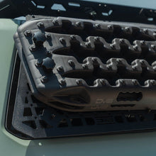 Load image into Gallery viewer, Wide shot of the passenger-side panel installed over the rear window on a 4Runner equipped with the DV8 roof rack.