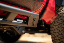 Load image into Gallery viewer, DV8 Offroad 24-25 Toyota Tacoma Double Cab Rock Sliders view 11