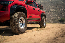 Load image into Gallery viewer, DV8 Offroad 24-25 Toyota Tacoma Double Cab Rock Sliders view 1