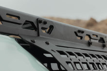 Load image into Gallery viewer, Close-up of the DV8 branding and mounting edge on the window Molle panel