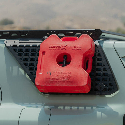 Orange storage pouch mounted to the exterior window Molle panel