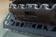 Load image into Gallery viewer, Close-up of DV8 molle panel weave pattern mounted to roof rack
