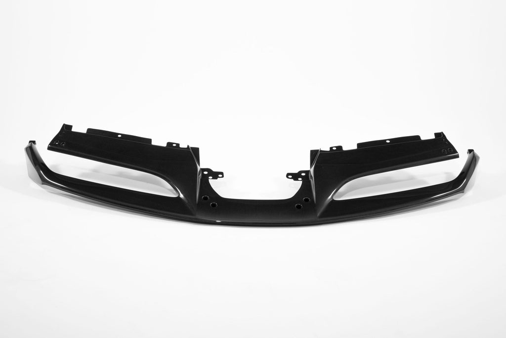 Full width front view of the Ferrari 488 carbon fiber front lip laid flat on a white background