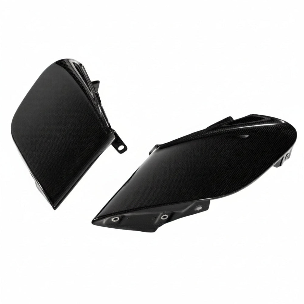 Pair of Ferrari 488 carbon fiber side intake fins with one piece standing upright and one laid flat showing the inner mounting rail
