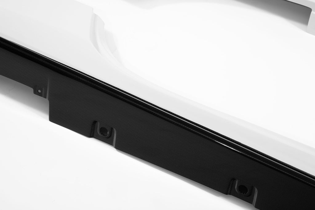 Close-up of the black trim edge and mounting flange on a Ferrari 488 side skirt