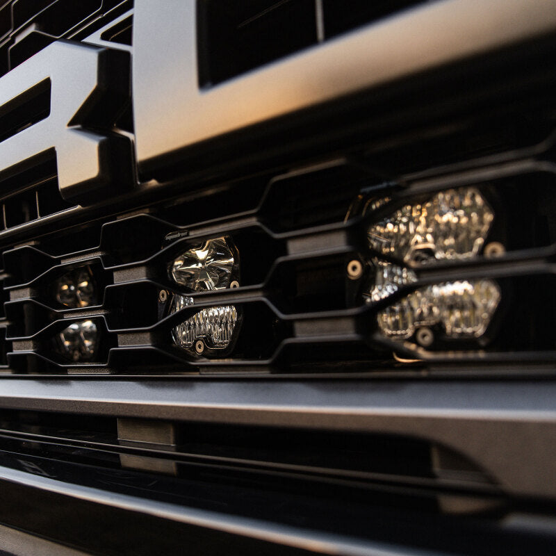 Ford F-150 Raptor behind grille light kit with six Baja Designs Squadron Sport 2.0 LED pods and upfitter harness