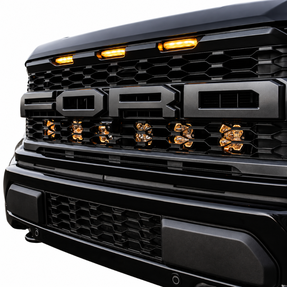 Ford Raptor Baja Designs Squadron Pro clear LED grille lights with mixed beam patterns
