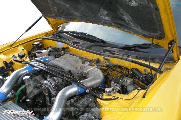 GReddy hood lifters installed on RX-7 FD3S with hood open