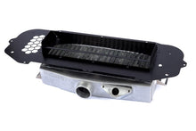 Load image into Gallery viewer, GrimmSpeed 093077 TMIC splitter positioned over a top mount intercooler