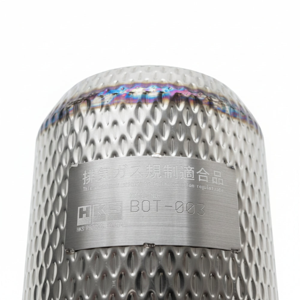 Close-up of HKS turbo kit heat shield mesh cover with compliance label